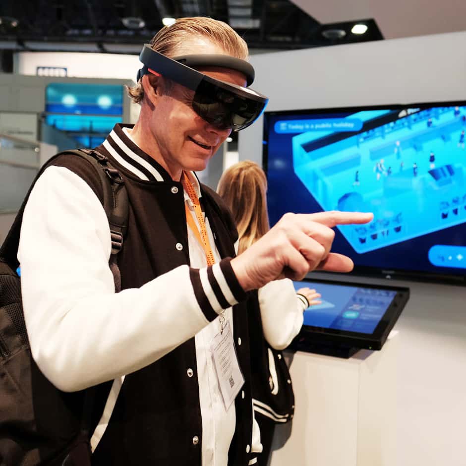 User interacting with mixed reality interface at trade fair