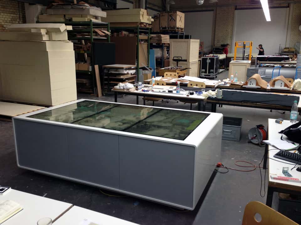 Assembled multitouch table prototype in the workshop during system integration and testing.