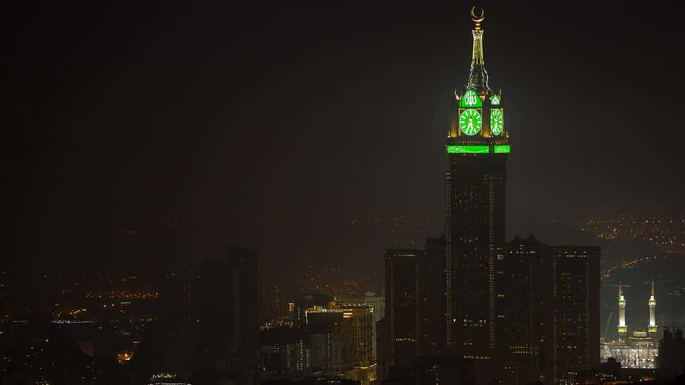 A photo of the Mekka Tower at night