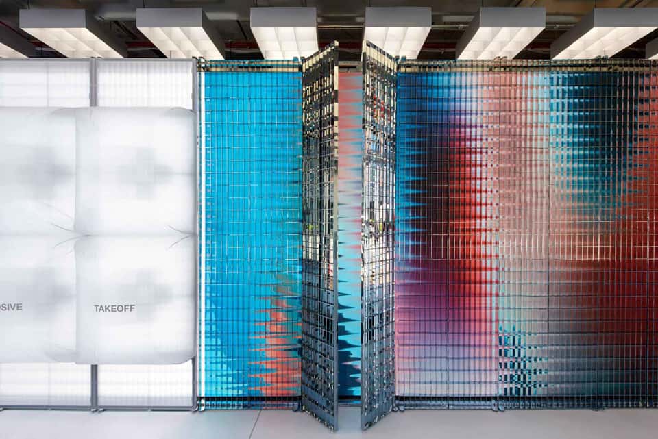 Close-up of the LED wall in an On Running store showing an abstract, colorful visualization.